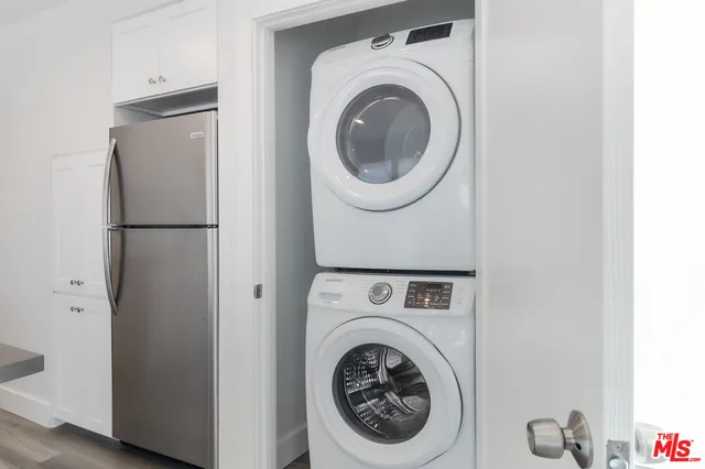 a kitchen with stainless steel appliances granite countertop a stove and a microwave