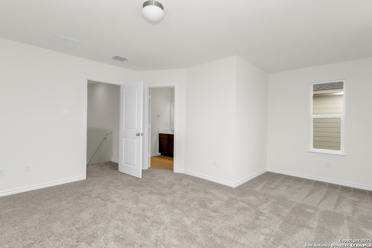 14458 Ribbon Tail Elmendorf, TX 78112 - Photo 12 of 22 a view of an empty room with a window