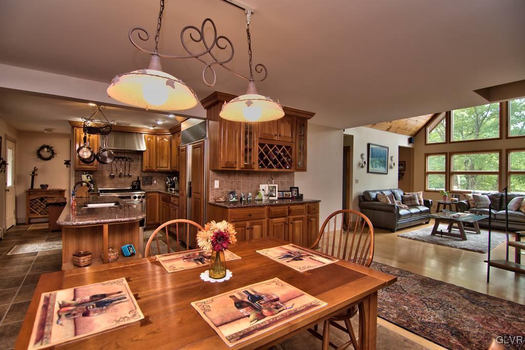 116 Rugosa Road Cresco, PA 18326 - Photo 6 of 19 a living room with furniture a rug and a floor to ceiling window