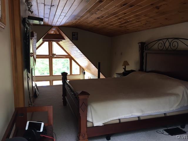 116 Rugosa Road Cresco, PA 18326 - Photo 10 of 19 a bed sitting in a bedroom next to a window