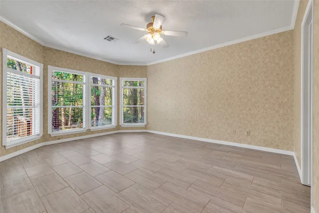 a bath tub sitting in a bathroom next to a window