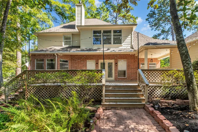 a view of a park with large trees