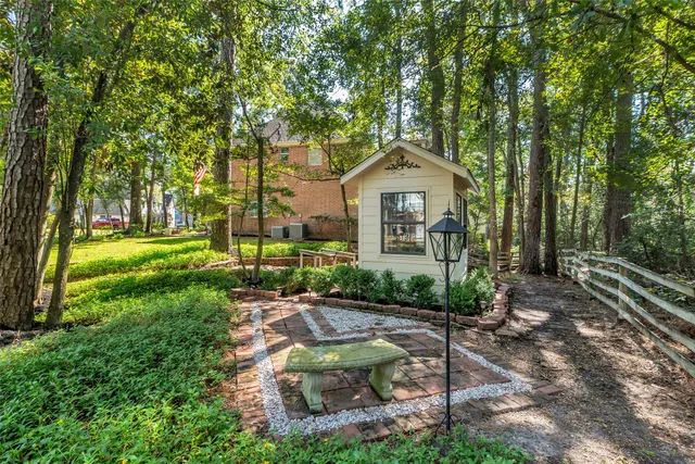 a view of backyard of house with green space