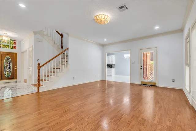 a view of an entryway with wooden floor