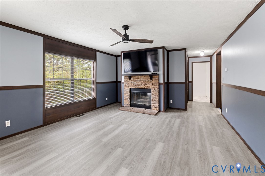 11391 Watkins Road Rockville, VA 23146 - Photo 12 of 28 a view of empty room with a fireplace and a window