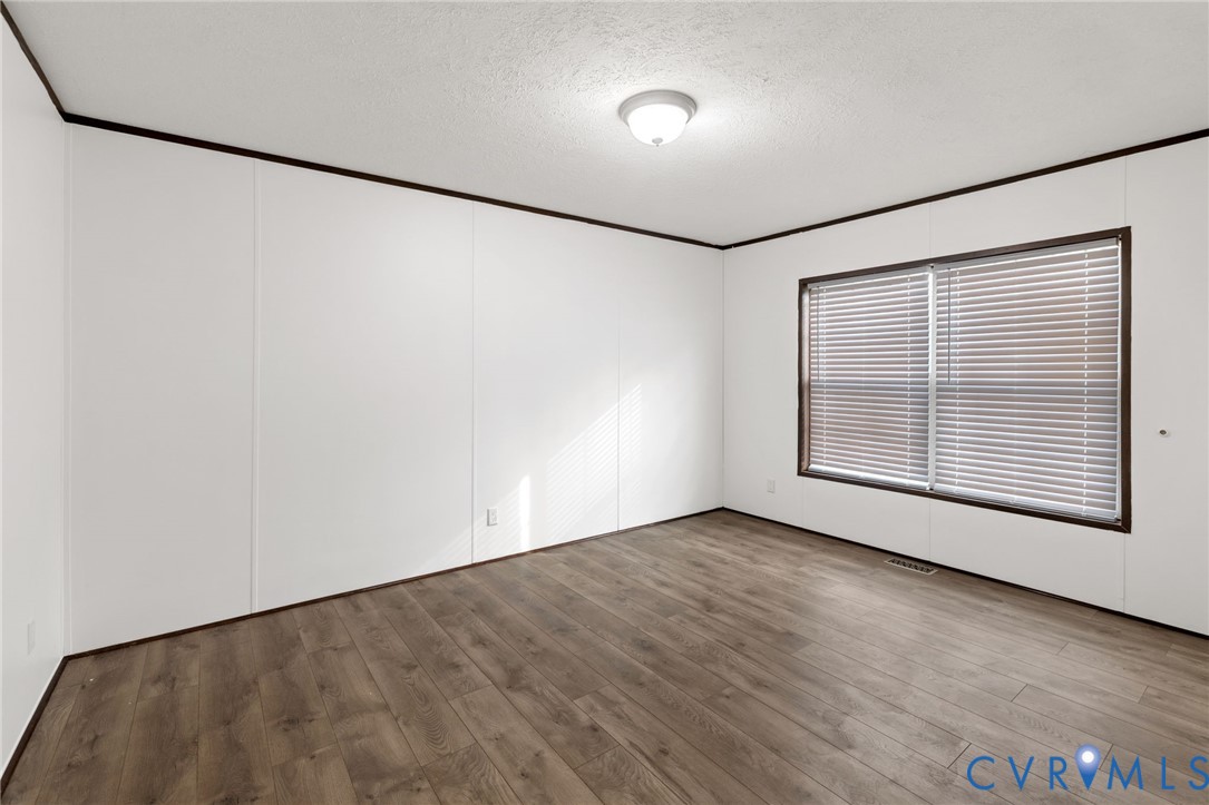 11391 Watkins Road Rockville, VA 23146 - Photo 15 of 28 an empty room with a empty space and windows