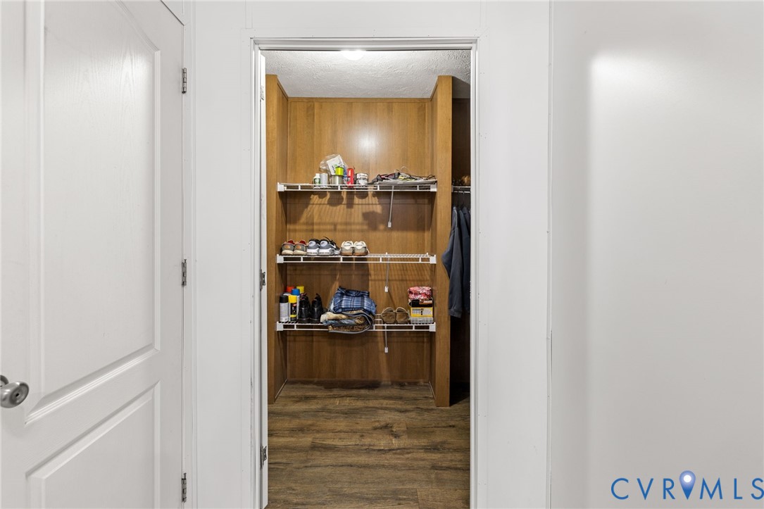 11391 Watkins Road Rockville, VA 23146 - Photo 24 of 28 a view of a living room with a wooden floor