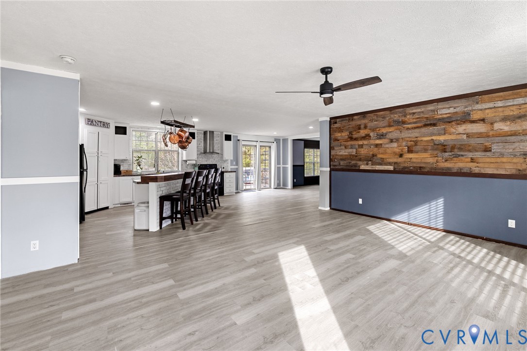 11391 Watkins Road Rockville, VA 23146 - Photo 4 of 28 a view of a dining room with furniture wooden floor and chandelier