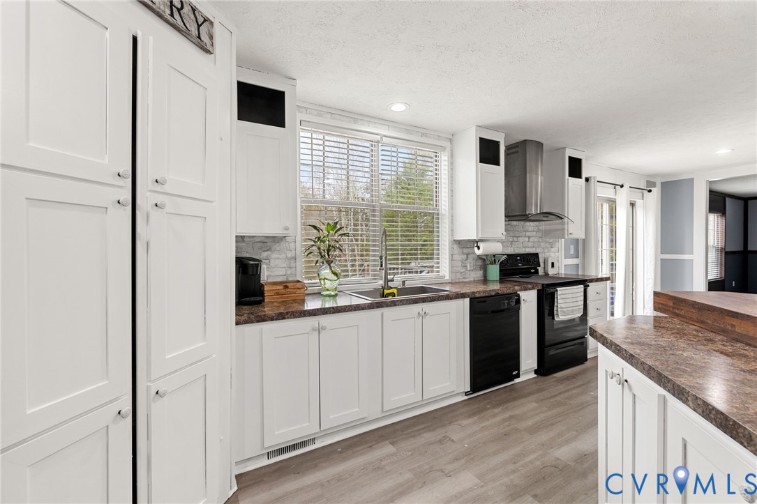 11391 Watkins Road Rockville, VA 23146 - Photo 7 of 28 a kitchen with stainless steel appliances granite countertop a sink and a refrigerator