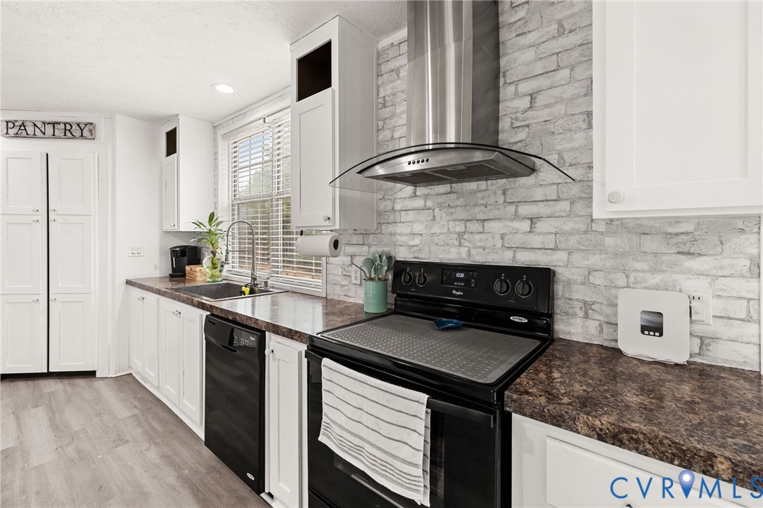 11391 Watkins Road Rockville, VA 23146 - Photo 8 of 28 a kitchen with a stove and a sink