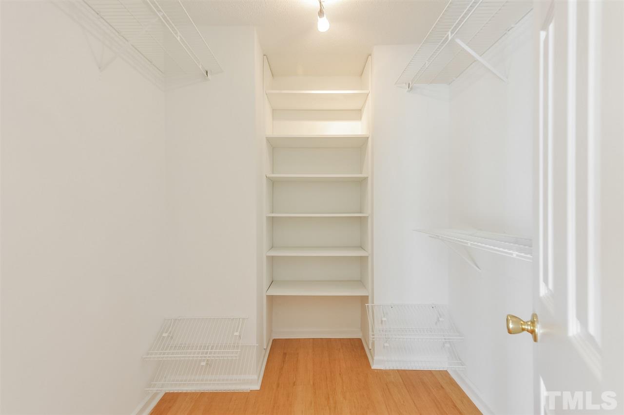 5100 Marathon Lane Raleigh, NC 27616 - Photo 14 of 24 a room with walk in closet and empty racks