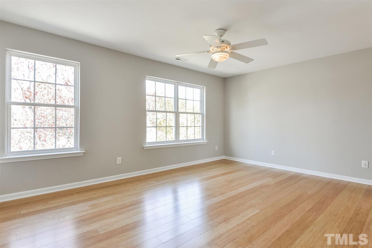 5100 Marathon Lane Raleigh, NC 27616 - Photo 19 of 24 a view of an empty room with wooden floor and a window