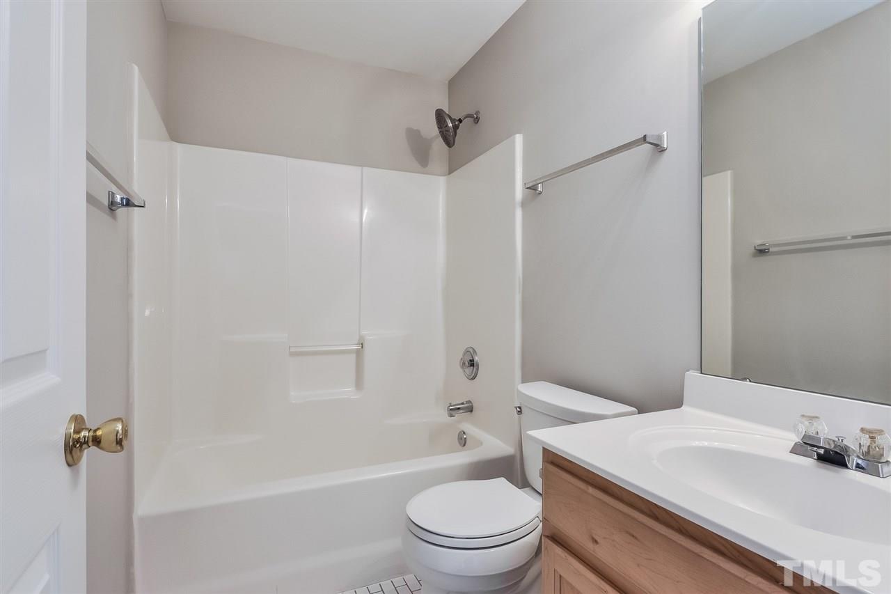5100 Marathon Lane Raleigh, NC 27616 - Photo 23 of 24 a bathroom with a sink toilet and shower