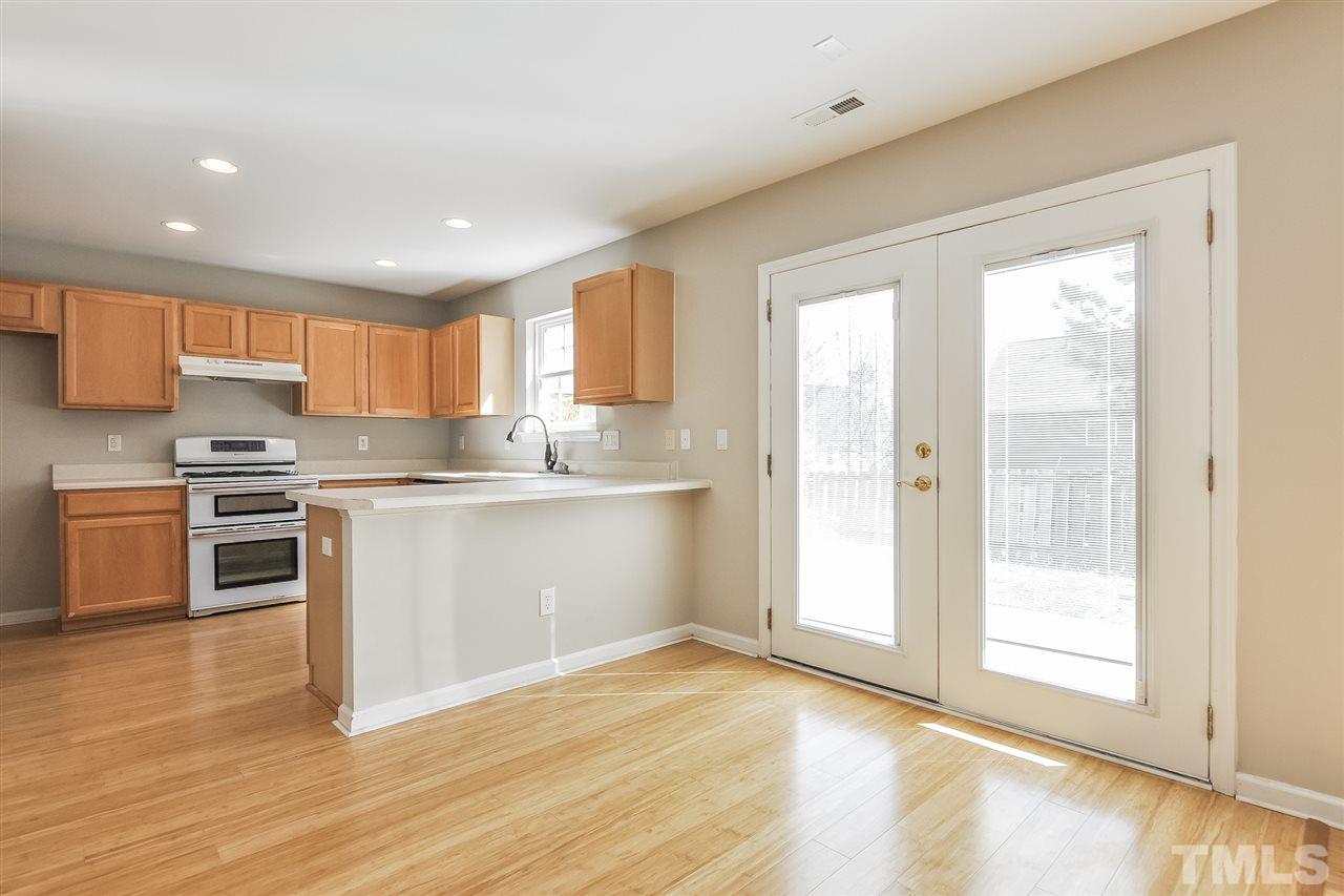 5100 Marathon Lane Raleigh, NC 27616 - Photo 6 of 24 a kitchen with granite countertop a refrigerator sink and cabinets