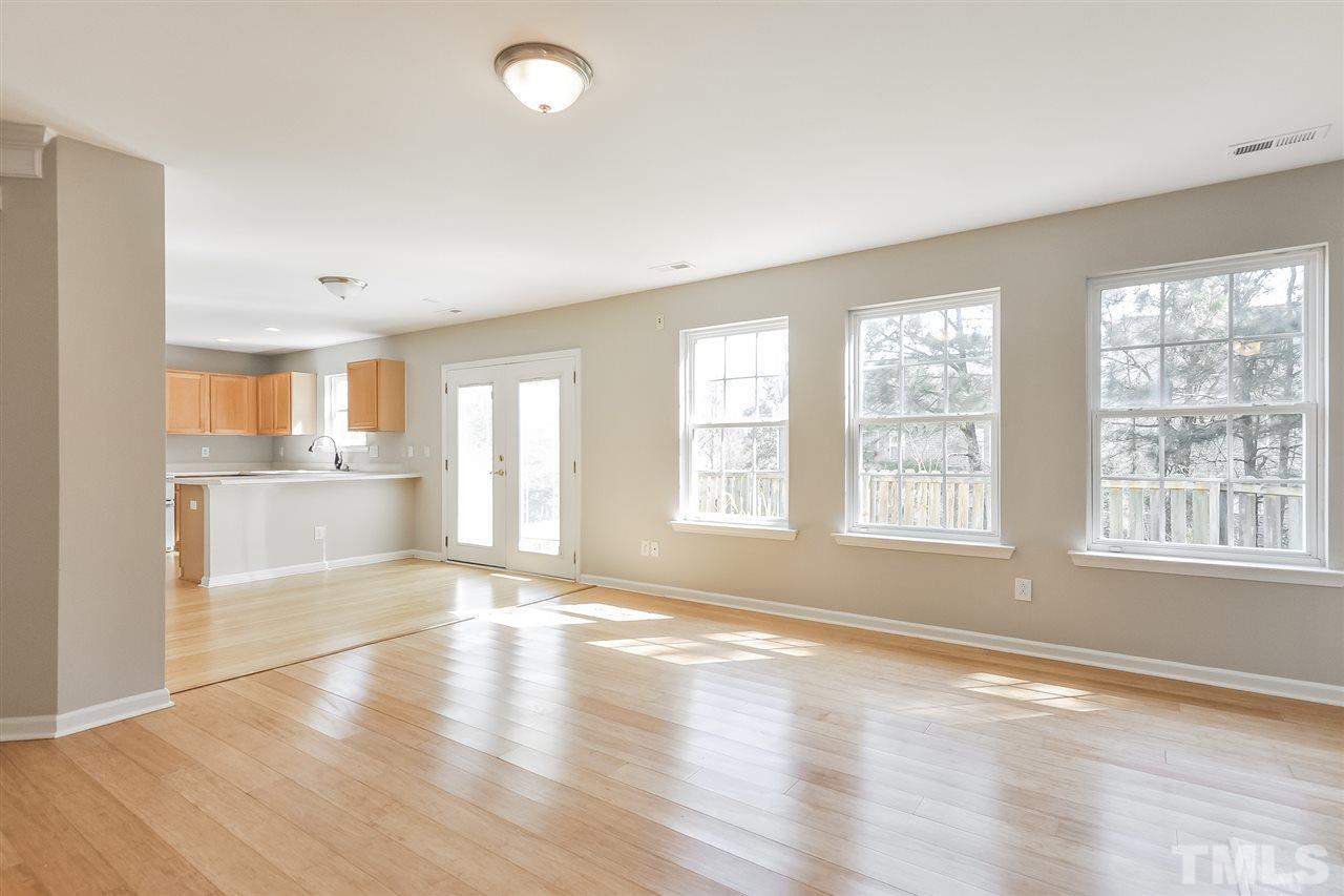 5100 Marathon Lane Raleigh, NC 27616 - Photo 9 of 24 a view of an empty room with wooden floor and a window