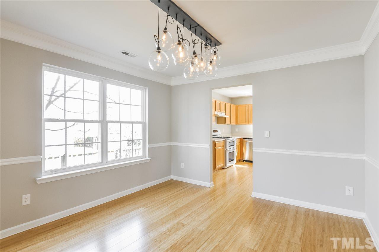 5100 Marathon Lane Raleigh, NC 27616 - Photo 10 of 24 wooden floor in an empty room with a window