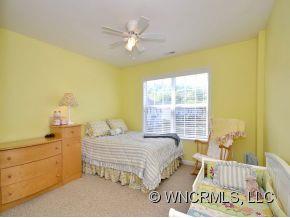 30 Woodfern Road Fletcher, NC 28732 - Photo 14 of 19 a bedroom with a bed and a window