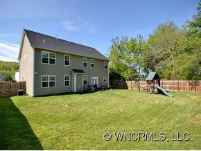 30 Woodfern Road Fletcher, NC 28732 - Photo 18 of 19 a view of a house with a yard and sitting area