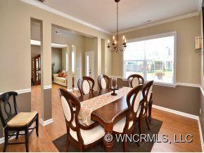 30 Woodfern Road Fletcher, NC 28732 - Photo 4 of 19 a view of a dining room with furniture window and wooden floor