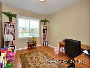 30 Woodfern Road Fletcher, NC 28732 - Photo 7 of 19 a bedroom with furniture and a book shelf