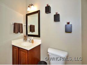 30 Woodfern Road Fletcher, NC 28732 - Photo 8 of 19 a bathroom with a toilet sink and mirror