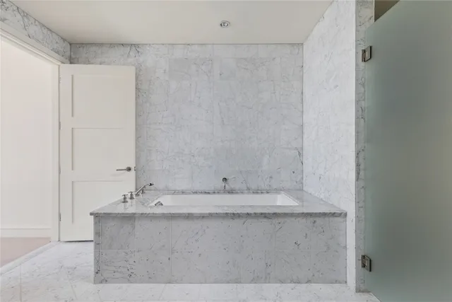 a bathroom with a double vanity sink and mirror