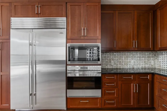 a room with lots of furniture and a rug