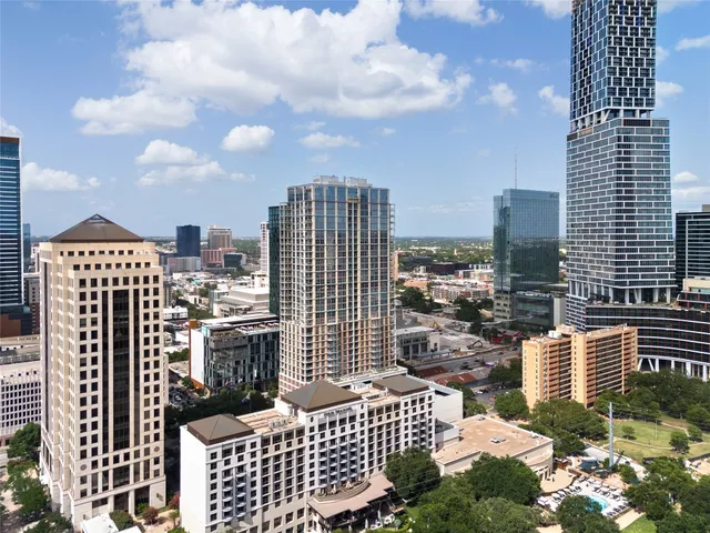 a view of empty room with wooden floor and floor to ceiling window