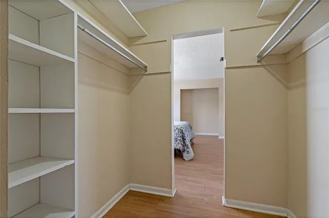 a bathroom with a toilet sink vanity and mirror