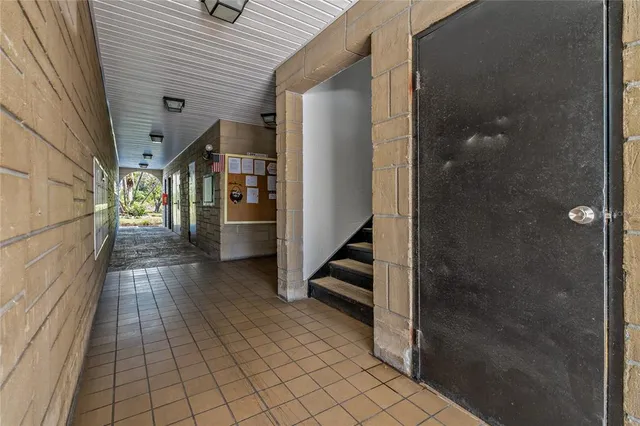 a view of a room with furniture and window
