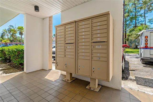 a view of swimming pool with outdoor seating and lake view