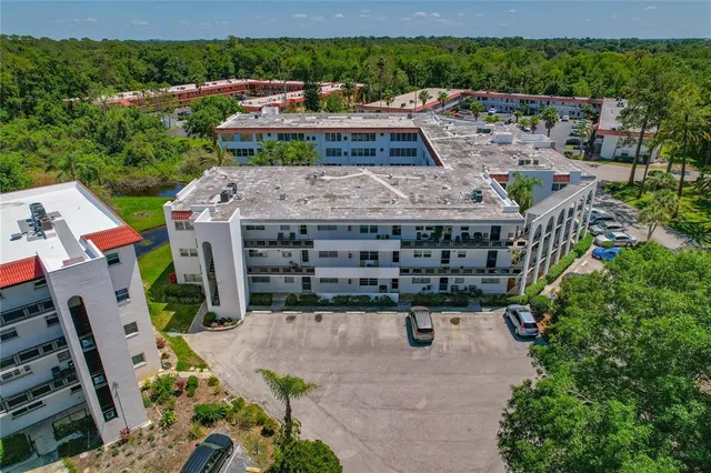 an aerial view of a house with a garden