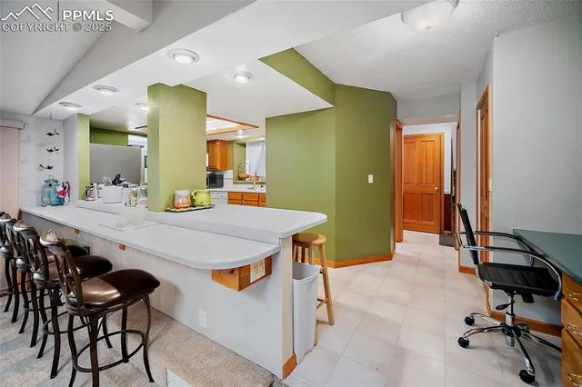 a kitchen with a table and chairs in it