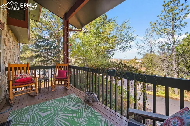 a balcony with chairs