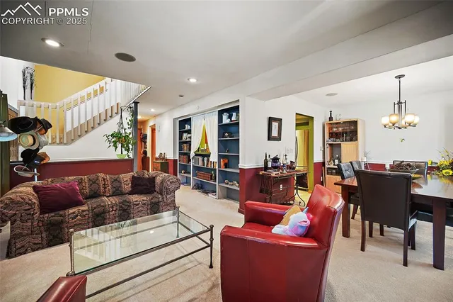 a living room with furniture potted plant and a window