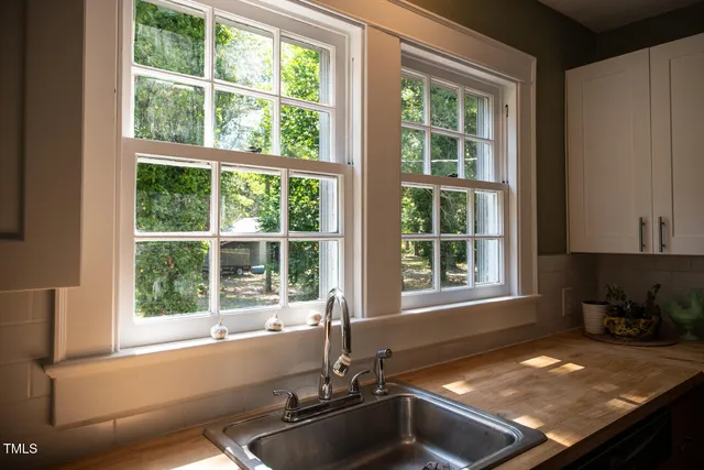 a kitchen with a sink and a window