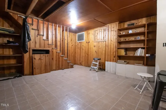 a view of an empty room with shelves