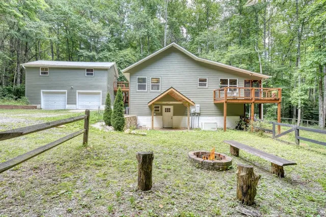 a view of an house with backyard space and garden
