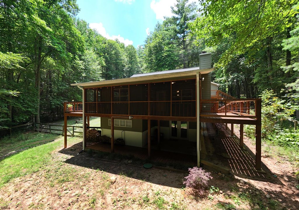 550 Watson Road Epworth, GA 30541 - Photo 11 of 63 a view of house with backyard outdoor seating and trees