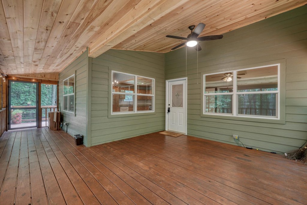 550 Watson Road Epworth, GA 30541 - Photo 15 of 63 a view of an empty room with a window and wooden floor
