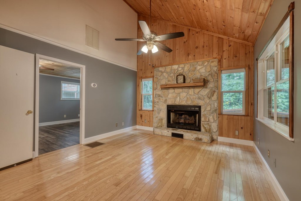 550 Watson Road Epworth, GA 30541 - Photo 19 of 63 a view of an empty room with wooden floor fireplace and a window