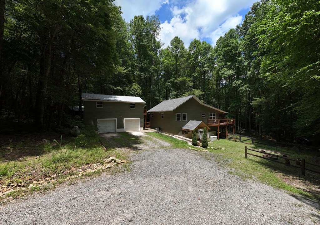 550 Watson Road Epworth, GA 30541 - Photo 2 of 63 a view of a house with backyard and trees