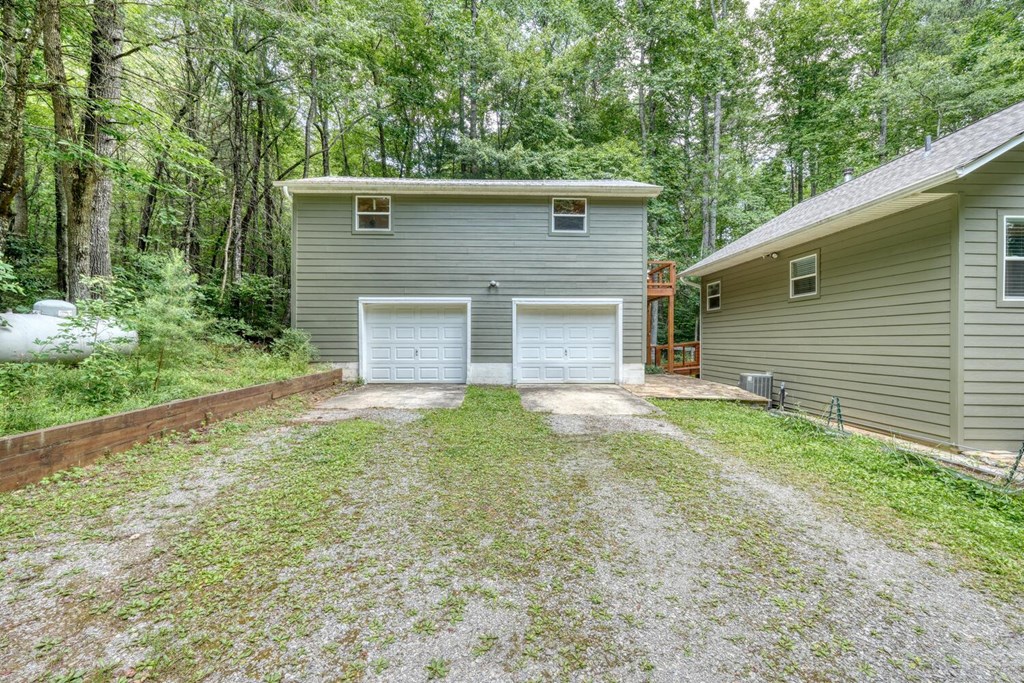 550 Watson Road Epworth, GA 30541 - Photo 40 of 63 a front view of a house with a yard and garage