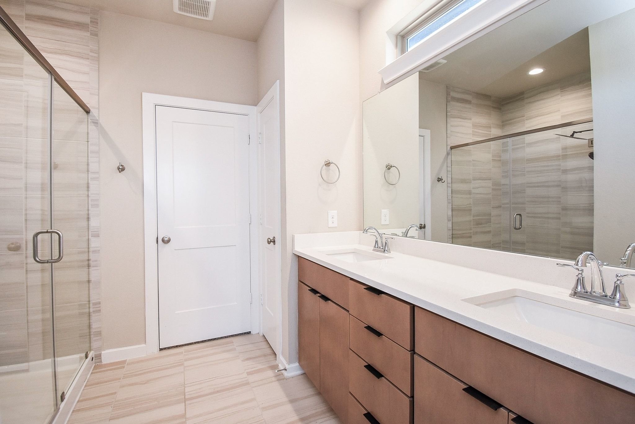 7643 Green Bulrush Way Katy, TX 77493 - Photo 14 of 20 a bathroom with a double vanity sink mirror and shower