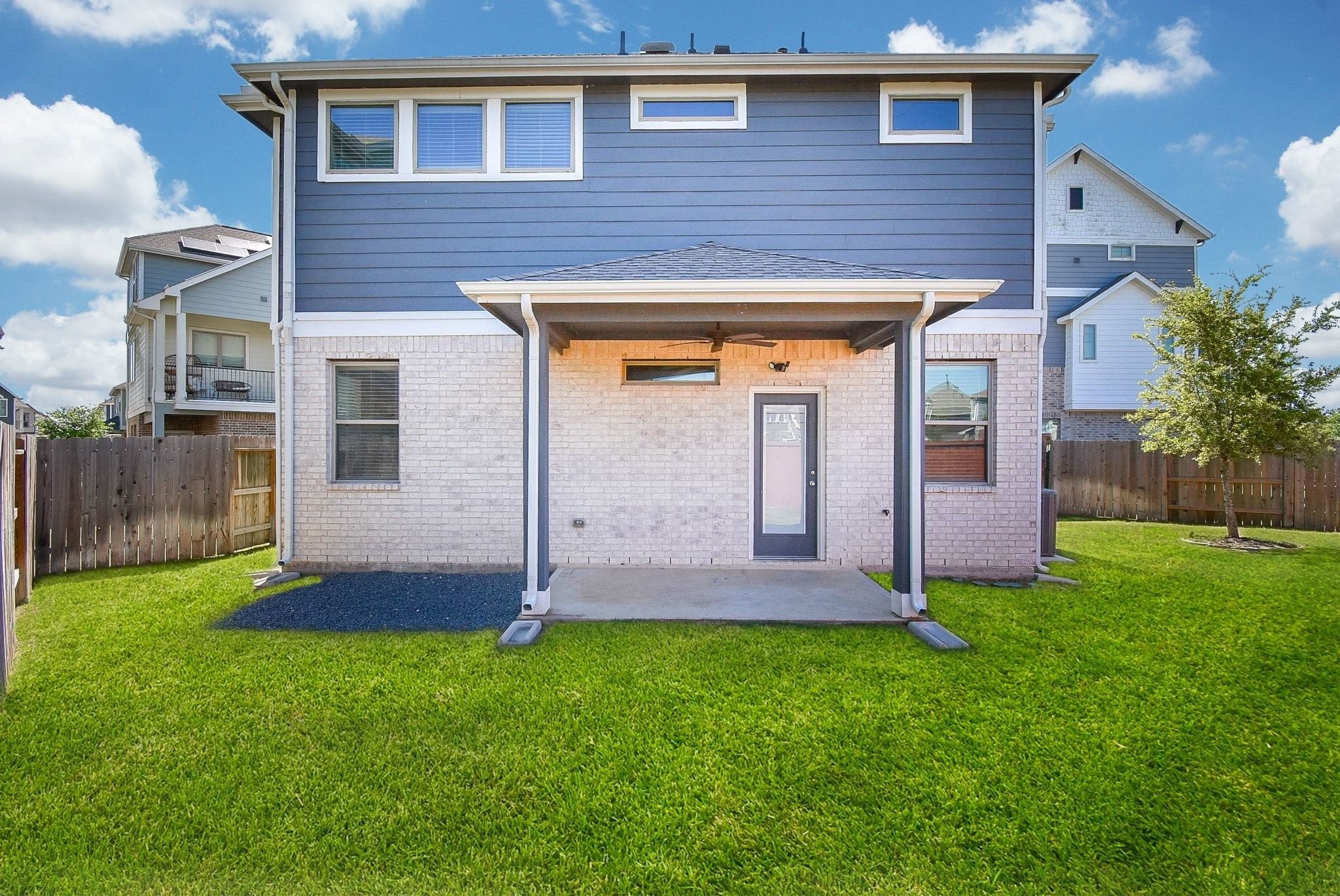 7643 Green Bulrush Way Katy, TX 77493 - Photo 2 of 20 a front view of a house with a yard