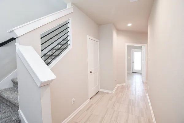 a view of a hallway with stairs