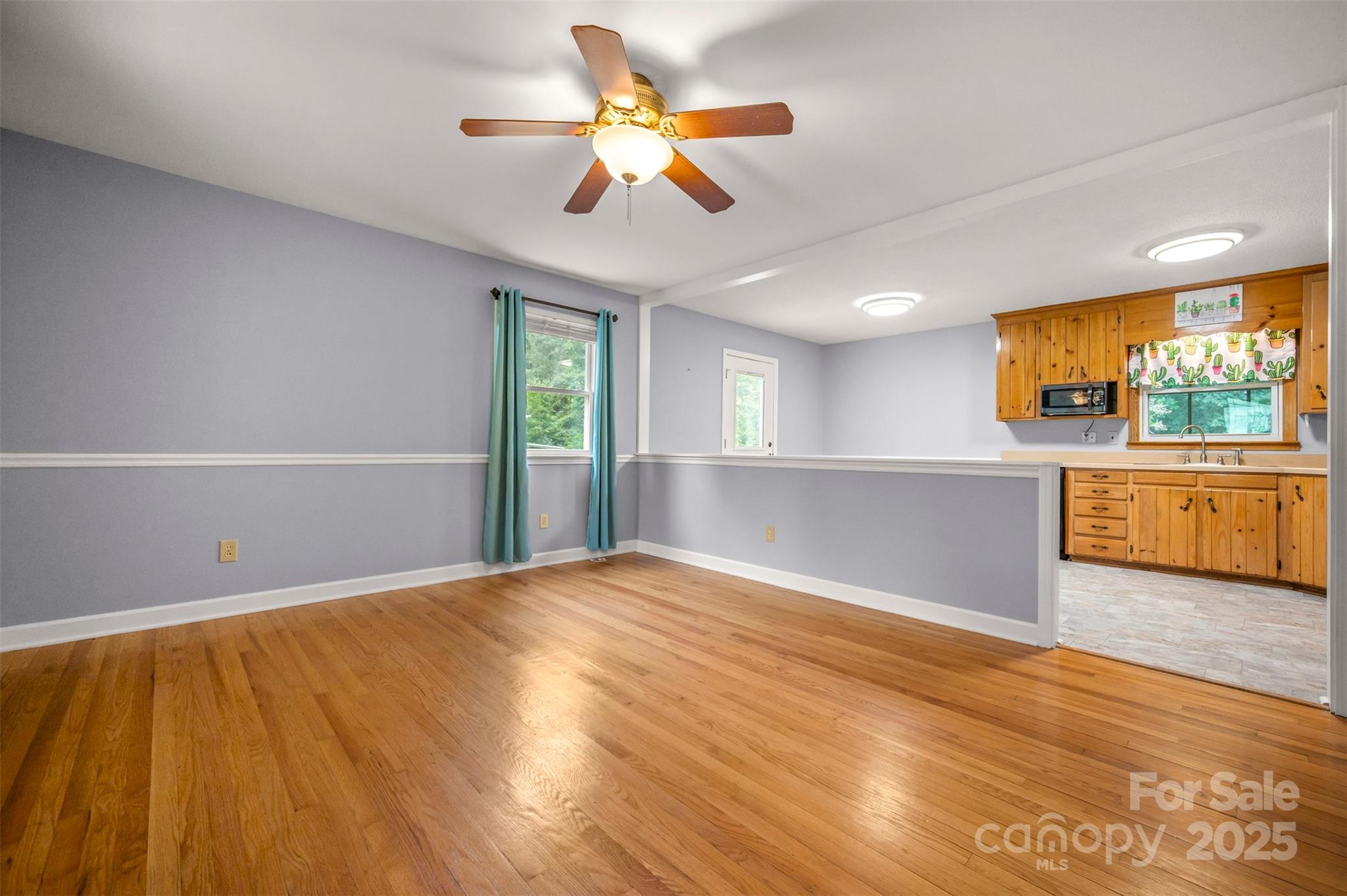 170 Hodge Street Rutherfordton, NC 28139 - Photo 13 of 48 a view of an empty room with a window and wooden floor