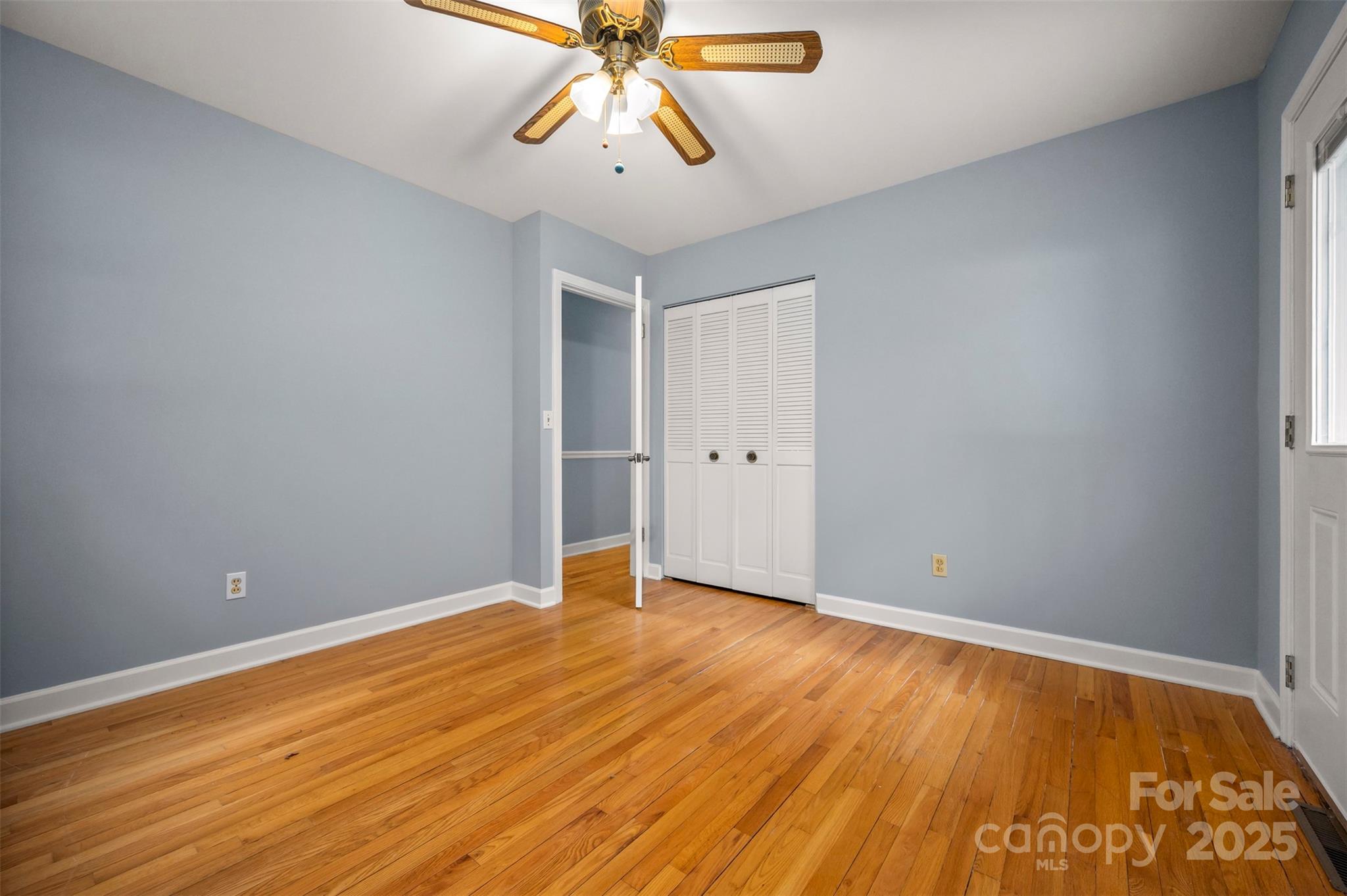 170 Hodge Street Rutherfordton, NC 28139 - Photo 26 of 48 wooden floor in an empty room with a chandelier fan