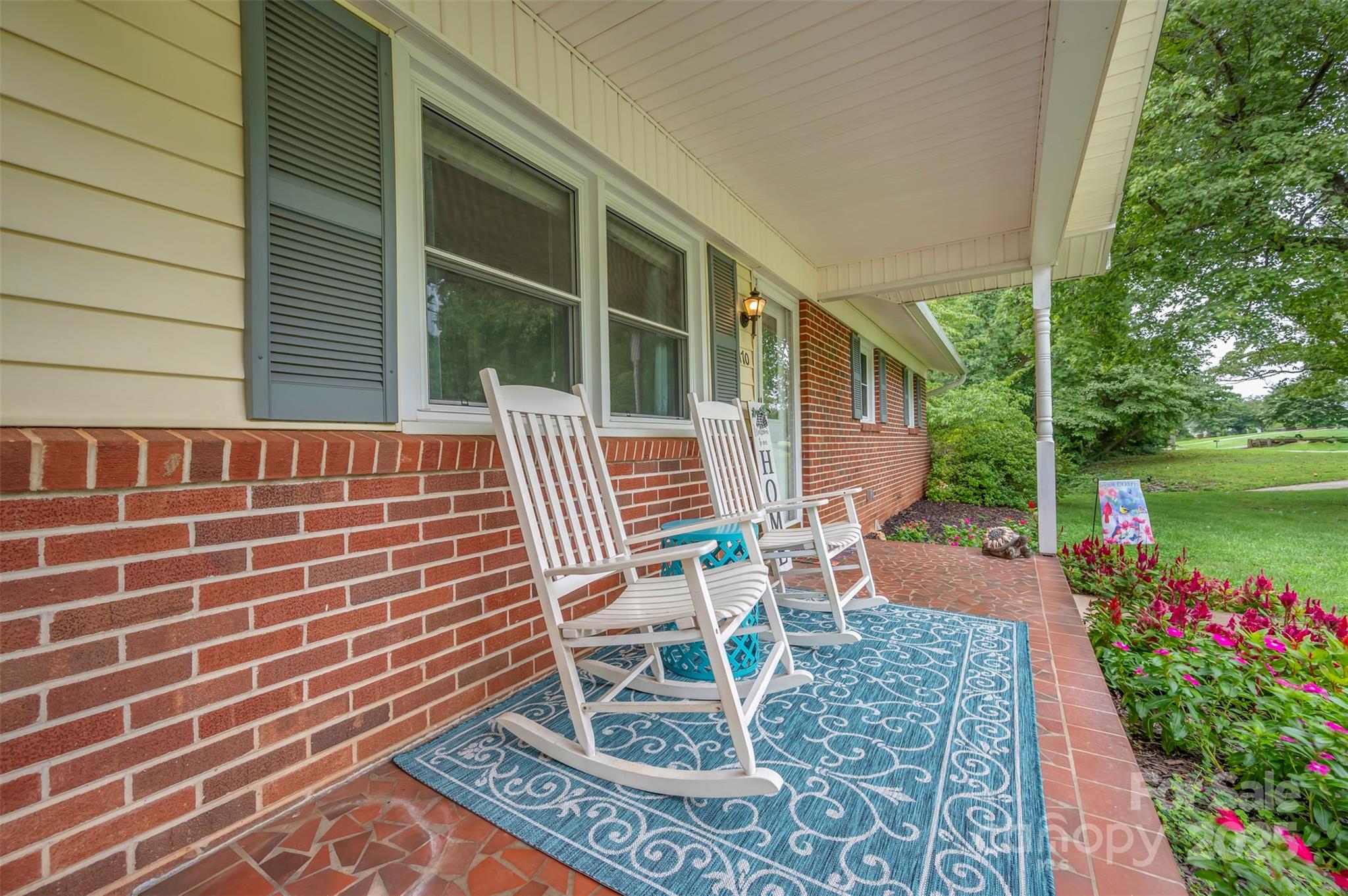 170 Hodge Street Rutherfordton, NC 28139 - Photo 7 of 48 a patio with table and chairs and potted plants
