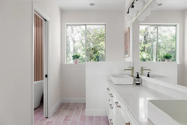 an aerial view of a house with a yard swimming pool and outdoor seating